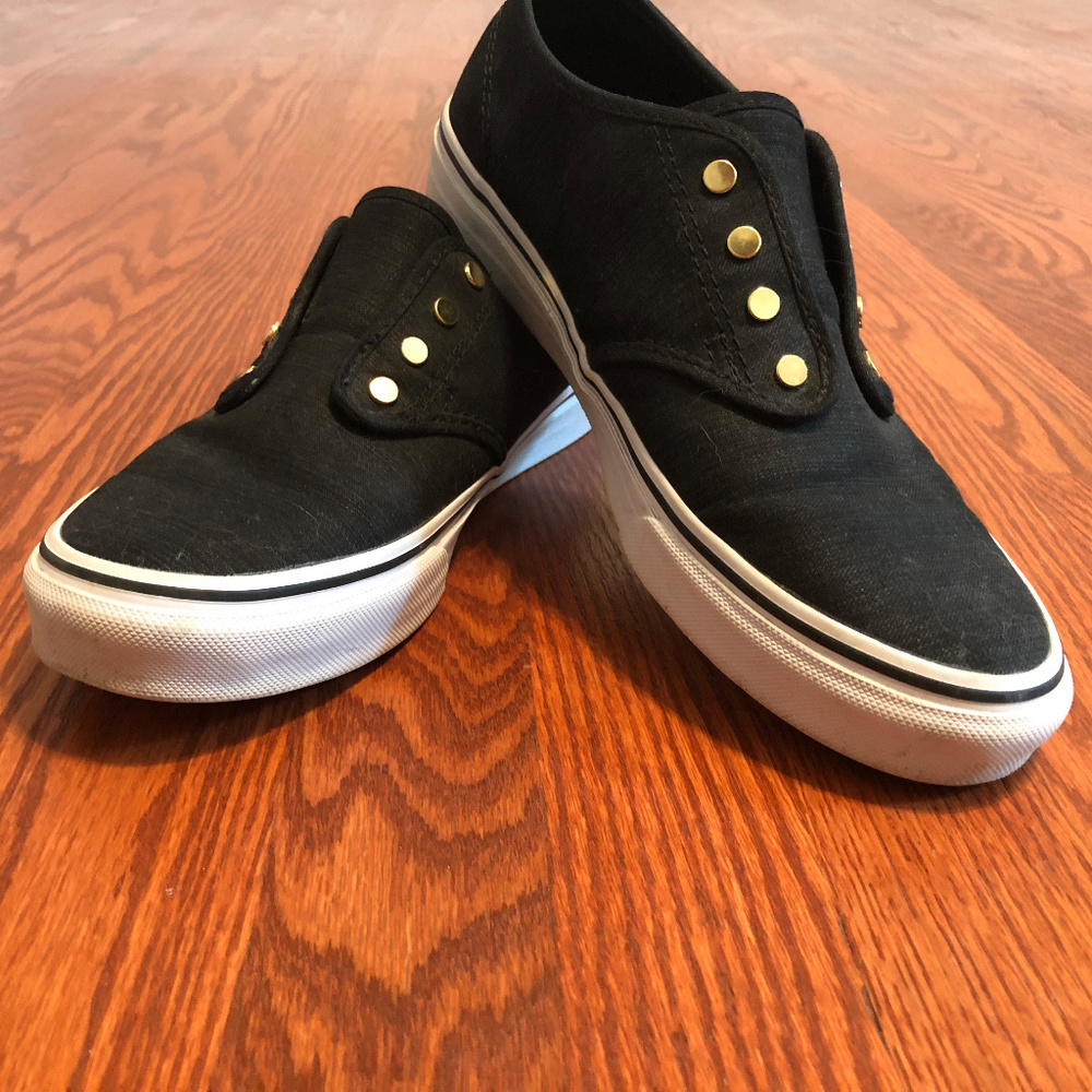Black vans with gold accent